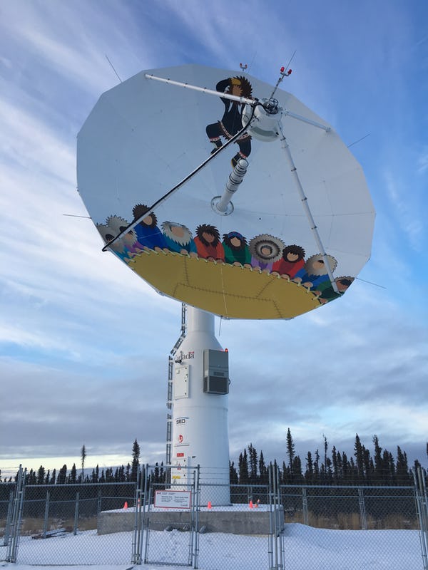 Satellite dish in Inuvik, Northwest Territories, Canada. It depicts a 'long-range scanning system' developed by Inuit peoples in the region, who would boost people up to look for animals. (Photo: Rob McMahon).