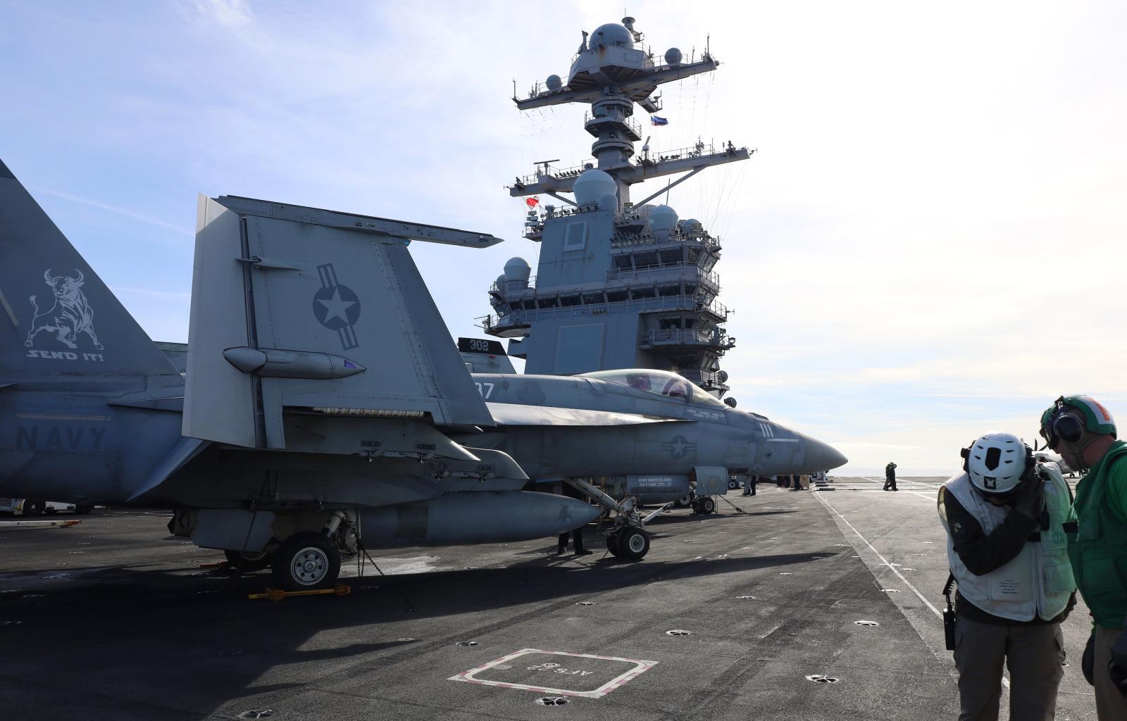 F-18s prepare to take off from the aircraft carrier USS Gerald R. Ford