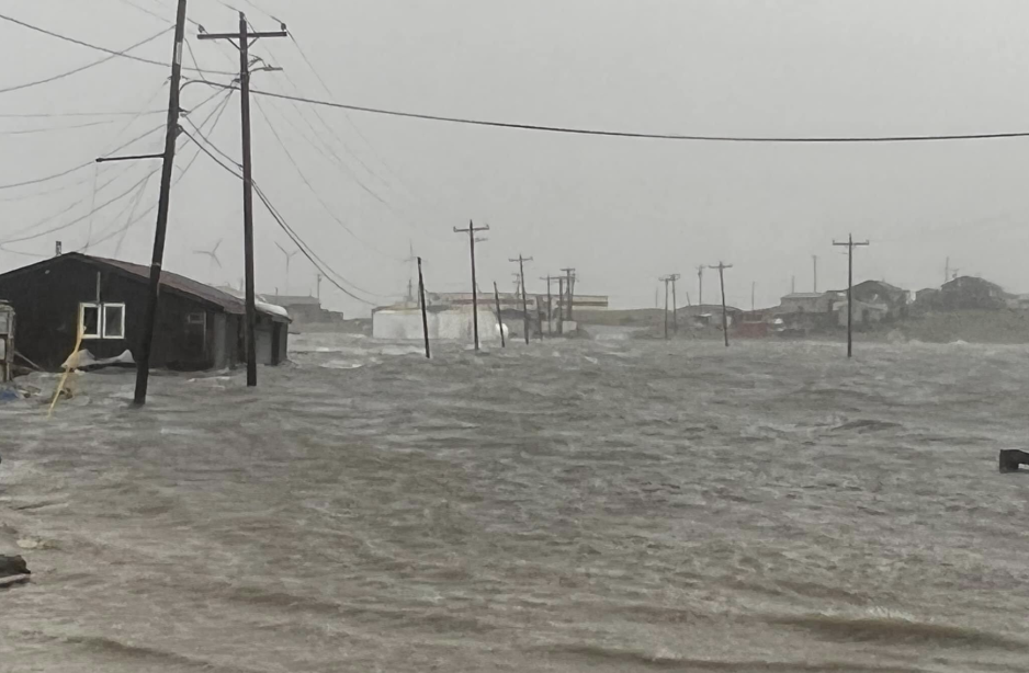 Flooded street in Hooper Bay. (Source: With permission by Ervin Chayalkun) Hooper Bay