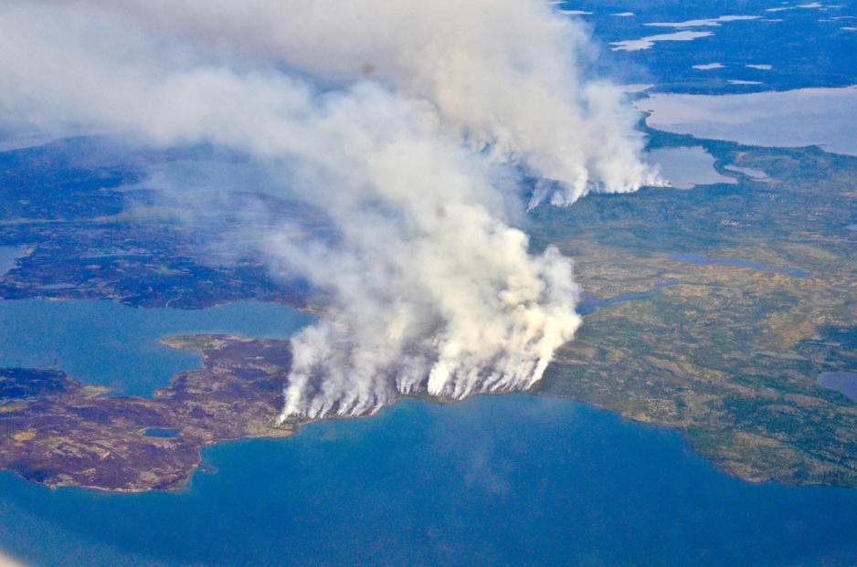 In 2014, megafires in Canada’s Northwest Territories scorched more than 7 million acres of forest, releasing half as much carbon back into the atmosphere as all the plants and trees in Canada typically absorb in an entire year. (Credit: NASA/Peter Griffith) 2014, megafires