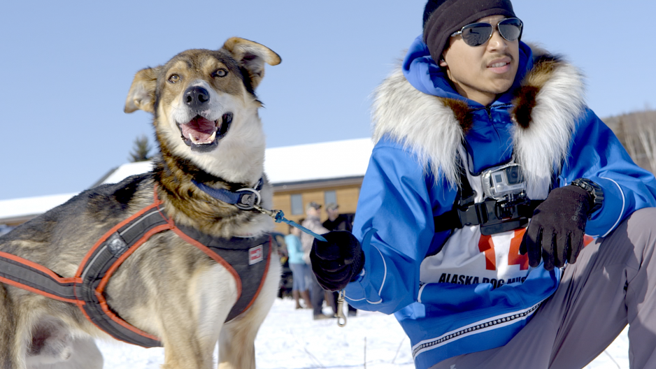 Joe Bifelt, George Attla’s grandnephew, with one of George’s dogs (named Happy) at the 2015 Open North American sled dog race (Photo credit: Catharine Axley)