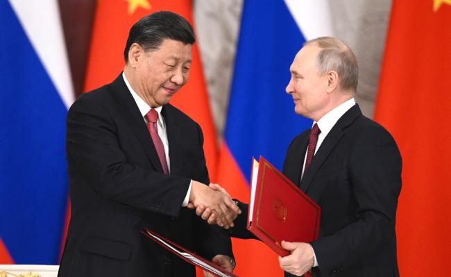President Xi and President Putin during the state visit in Moscow. (Source: Kremlin) xi and putin shaking hands