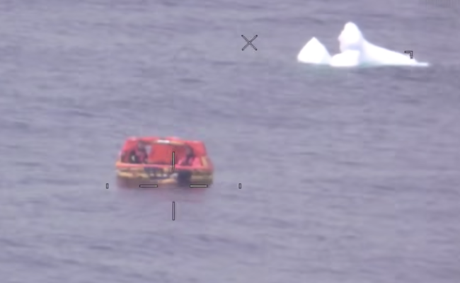 Survival raft with iceberg in the background. (Source: Joint Arctic Command)