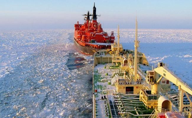 An icebreaker from Rosatomflot escorts a vessel through icy areas along the Northern Sea Route. Will future vessels avoid sailing in the Russian economic zone in order to avoid Putin's requirement about having a Russian escort? (Photo: Rosatomflot) Rosatomflot