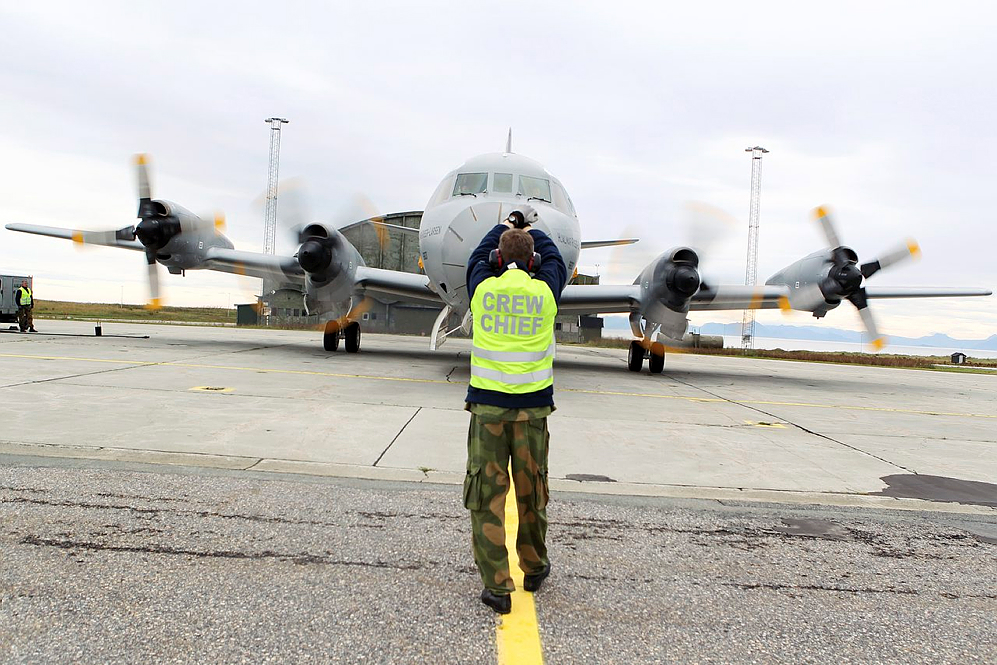 Maintenance crew check a Orion P-3N, Hjalmar Riiser-Larsen, from 333 squadron after mission at Andøya air base.